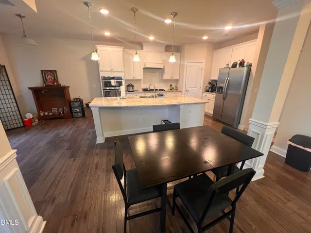 a living room with furniture flat screen tv and a fireplace