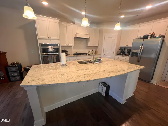 a view of a livingroom with wooden floor
