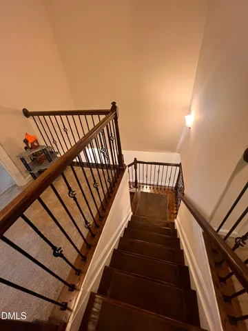 a bed sitting in a room next to a window