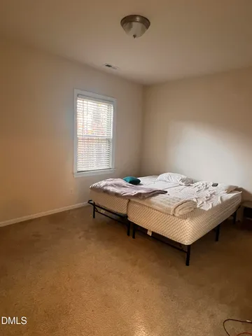 a spacious bathroom with a double vanity sink a mirror and a shower