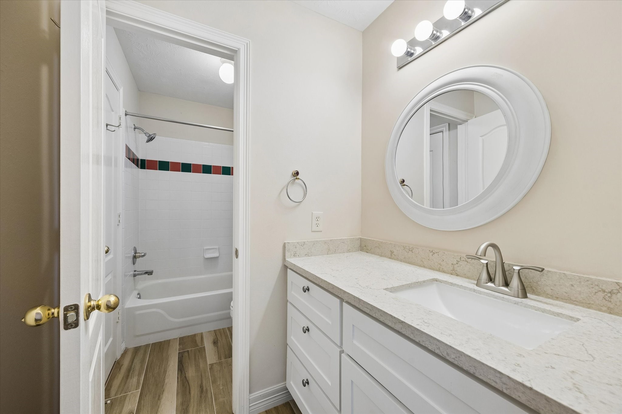 5306 Summerland Ridge Court Houston, TX 77041 - Photo 23 of 33 a bathroom with a granite countertop sink and a mirror