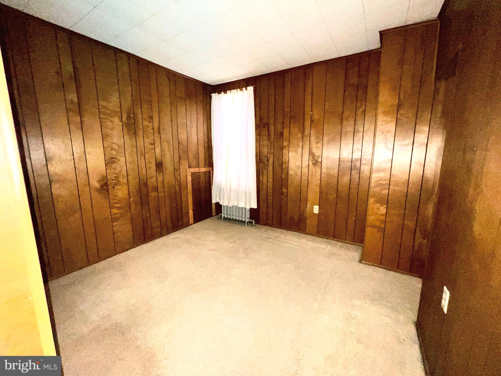 310 Hobart Street Gordon, PA 17921 - Photo 11 of 20 a view of an empty room with wooden walls