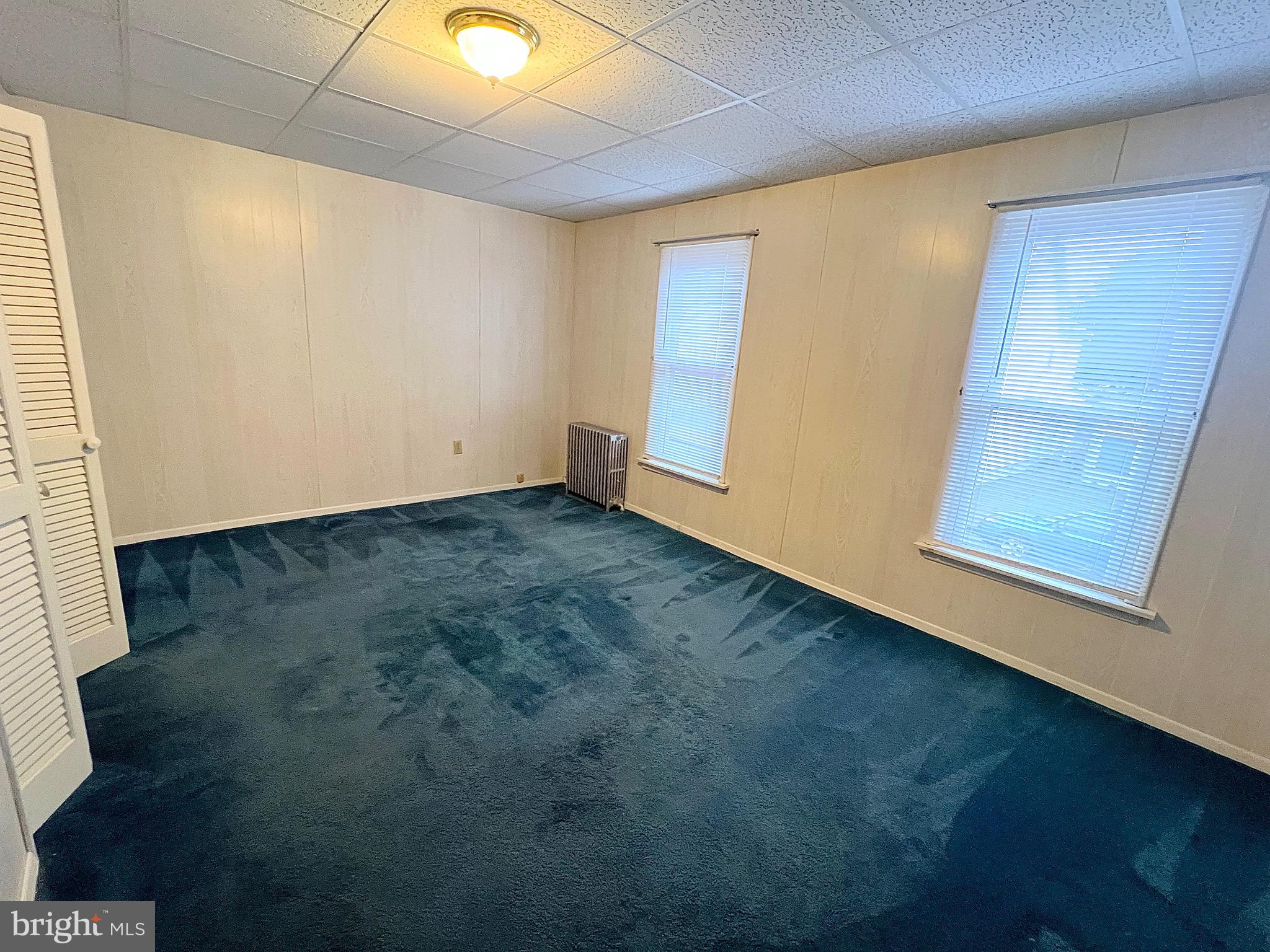 310 Hobart Street Gordon, PA 17921 - Photo 13 of 20 an empty room with wooden floor and windows