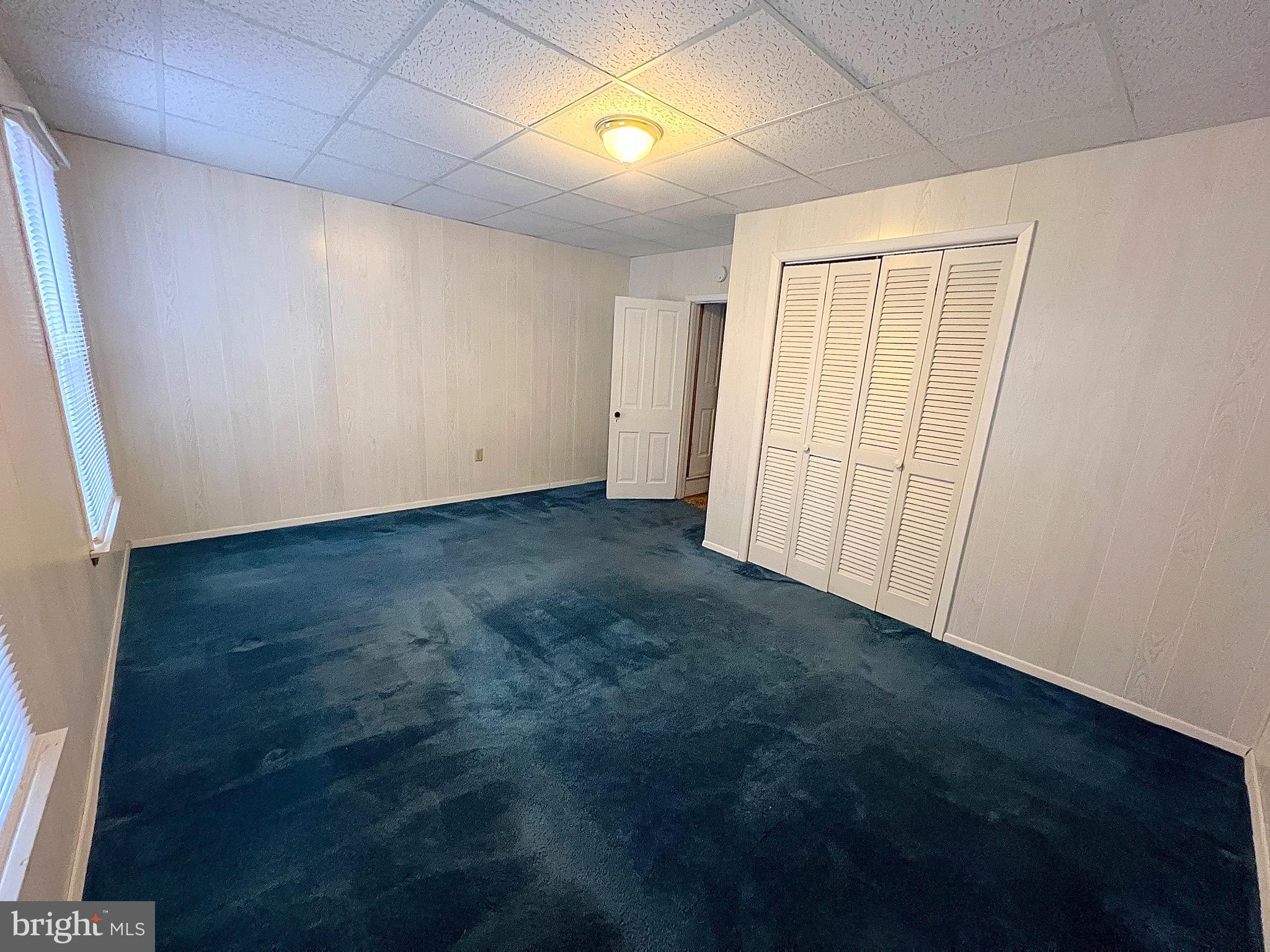 310 Hobart Street Gordon, PA 17921 - Photo 14 of 20 an empty room with wooden floor and natural light