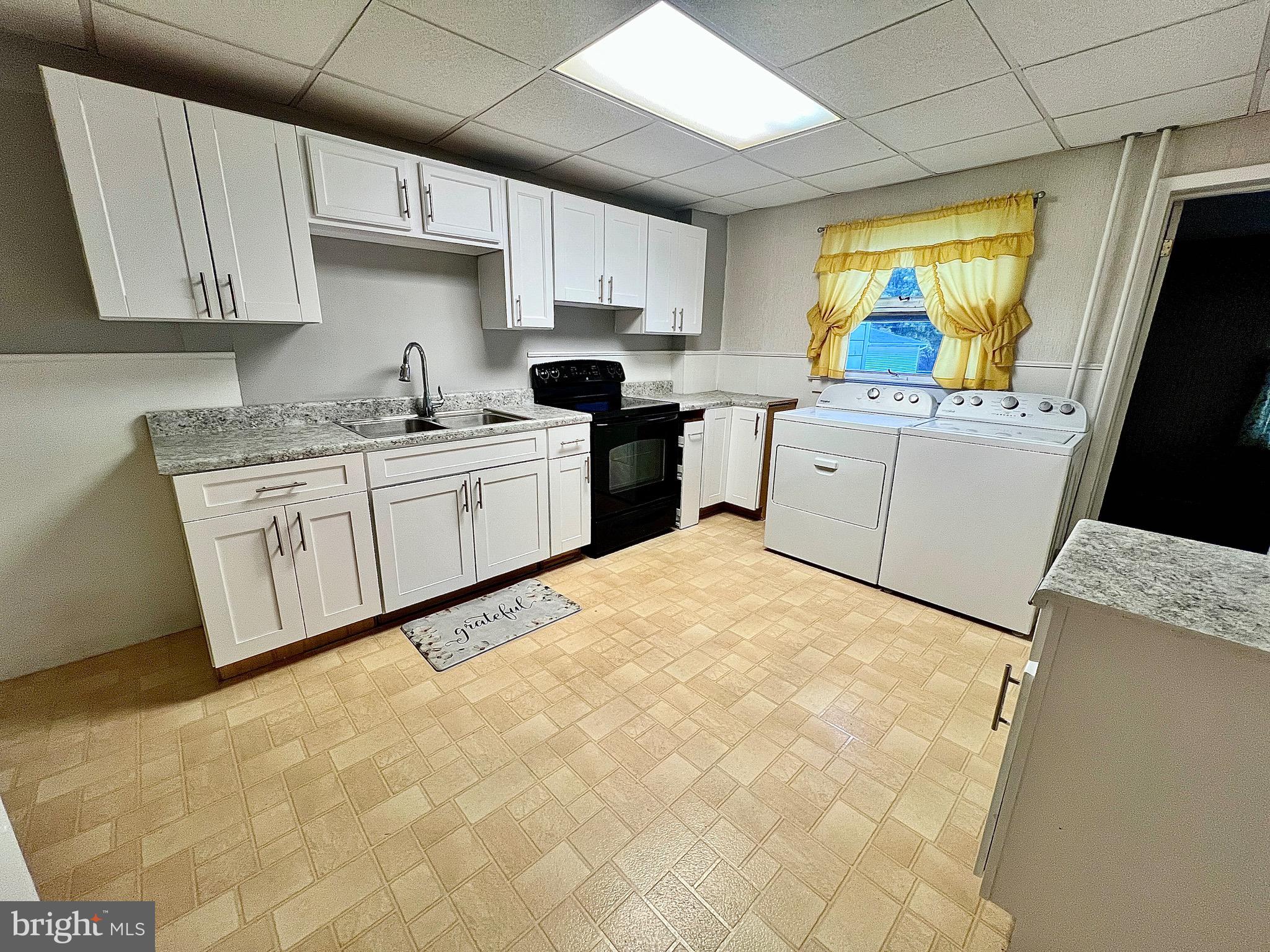 310 Hobart Street Gordon, PA 17921 - Photo 5 of 20 a kitchen with cabinets appliances and a window