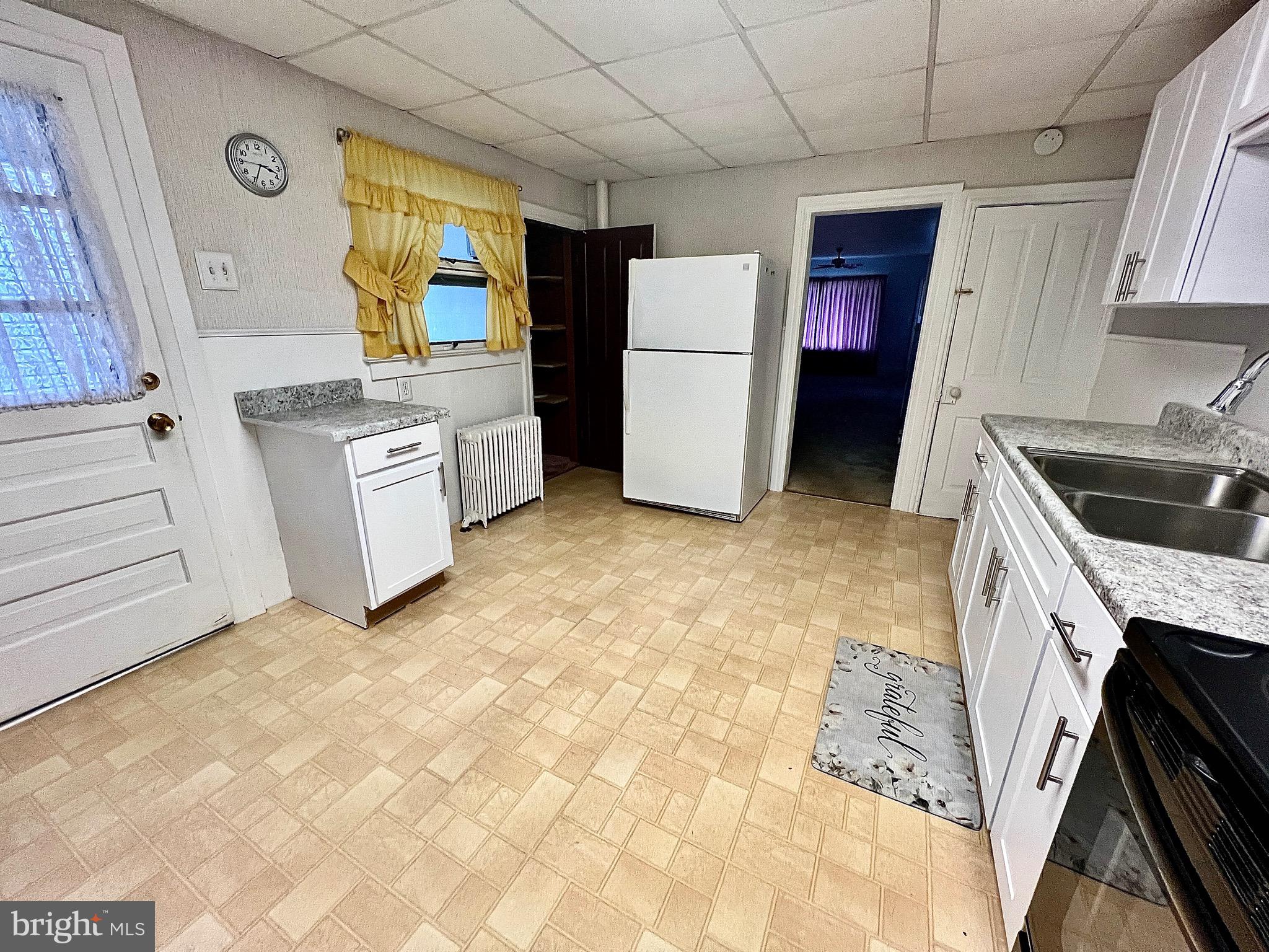 310 Hobart Street Gordon, PA 17921 - Photo 7 of 20 a kitchen with a refrigerator and a stove top oven