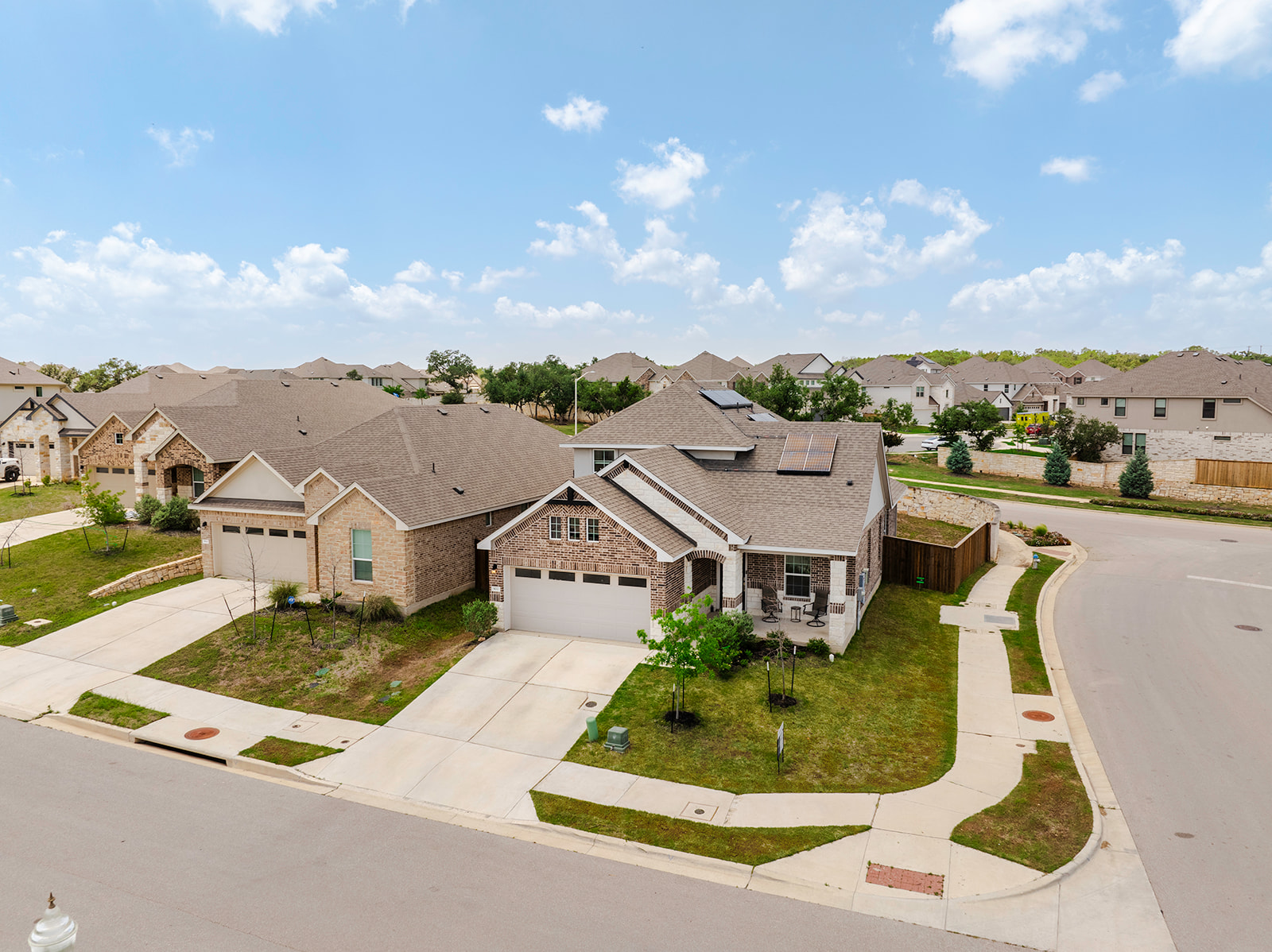 900 Balsora Cove Georgetown, TX 78628 - Photo 3 of 39 A welcoming brick exterior home in a suburban neighborhood offers inviting curb appeal.