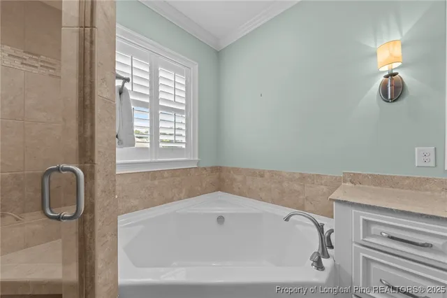 a white bath tub sitting next to a window