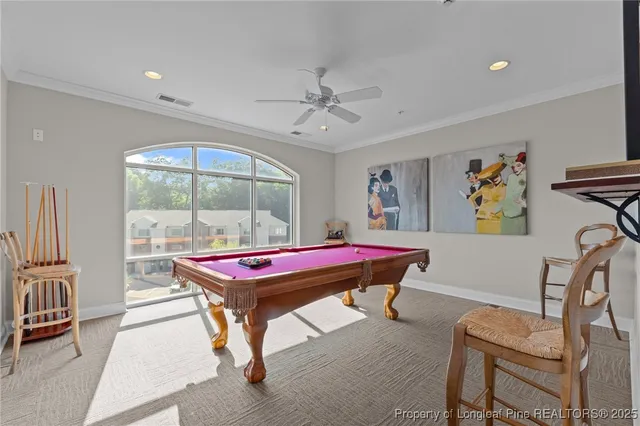 a room with a table workspace and a window