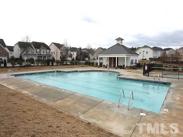 5408 Glass Ridge Road Raleigh, NC 27616 - Photo 22 of 24 a front view of a house with a yard and lake view