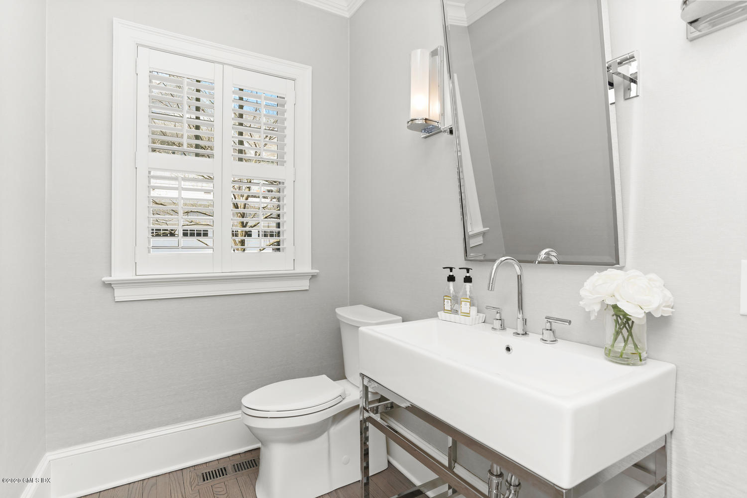 28 Welwyn Road Riverside, CT 06878 - Photo 11 of 32 a bathroom with a sink a toilet and a mirror