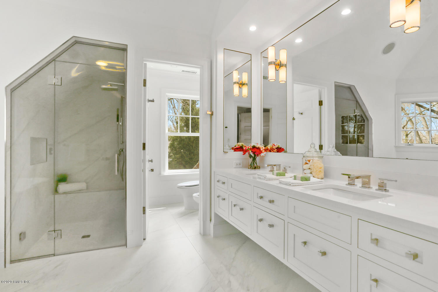 28 Welwyn Road Riverside, CT 06878 - Photo 14 of 32 a bathroom with a double vanity sink mirror and shower