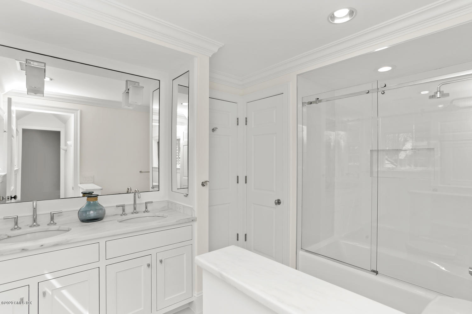 28 Welwyn Road Riverside, CT 06878 - Photo 17 of 32 a bathroom with a shower sink vanity and mirror