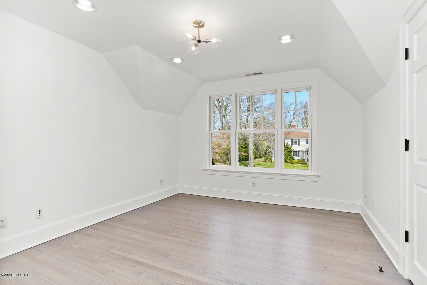 28 Welwyn Road Riverside, CT 06878 - Photo 18 of 32 an empty room with wooden floor and windows