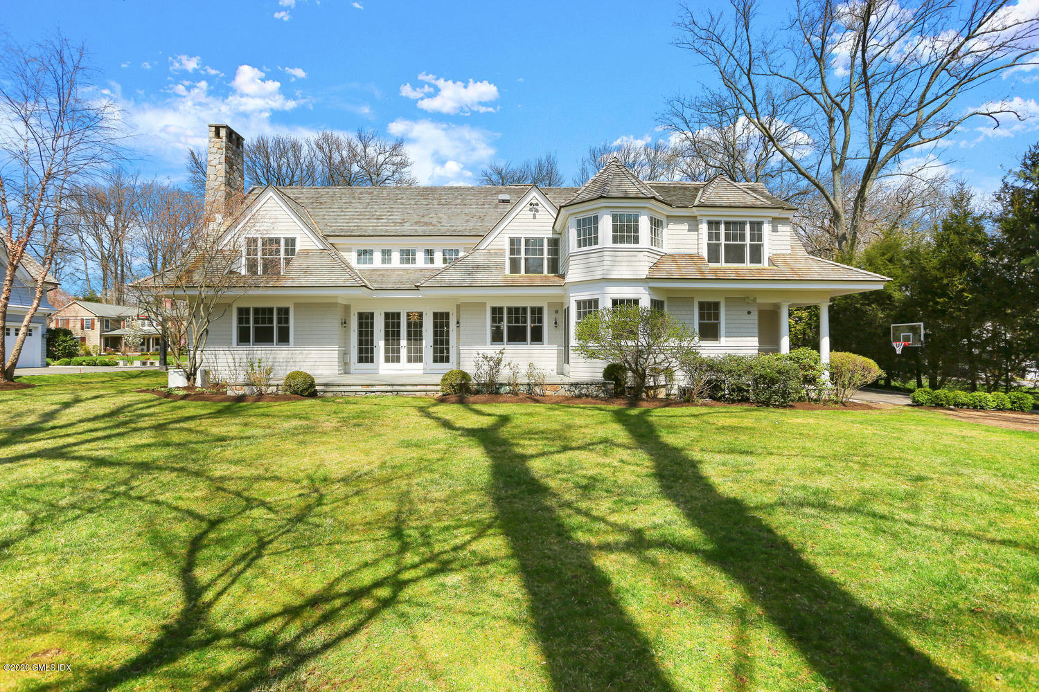 28 Welwyn Road Riverside, CT 06878 - Photo 29 of 32 a front view of a house with swimming pool having outdoor seating