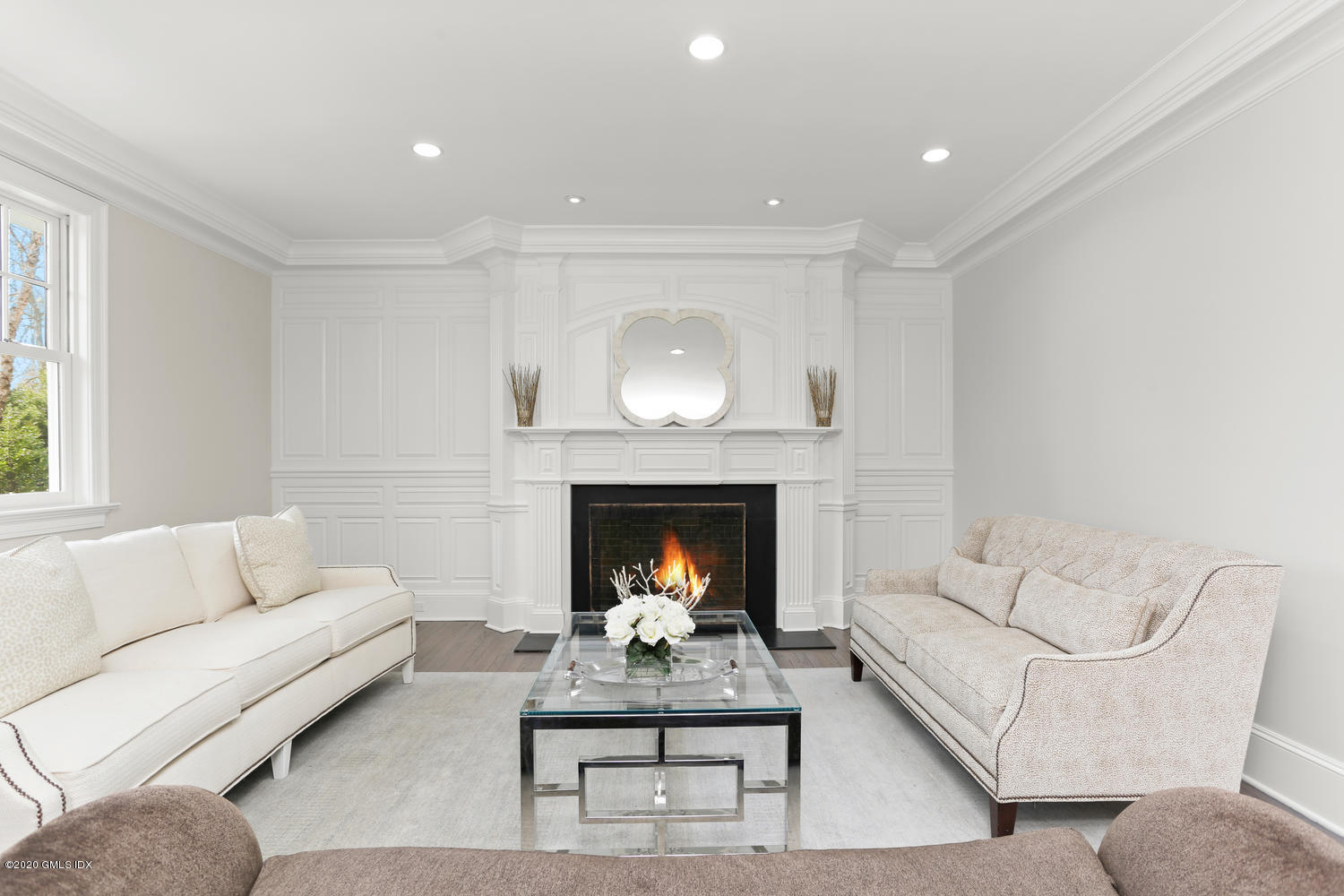 28 Welwyn Road Riverside, CT 06878 - Photo 3 of 32 a living room with furniture and a fireplace