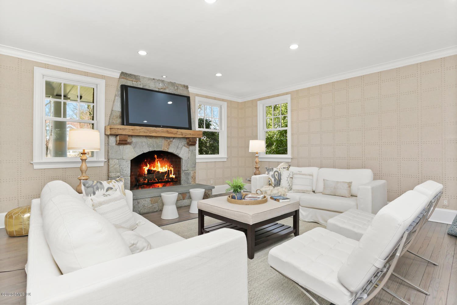 28 Welwyn Road Riverside, CT 06878 - Photo 8 of 32 a living room with couches and a fireplace