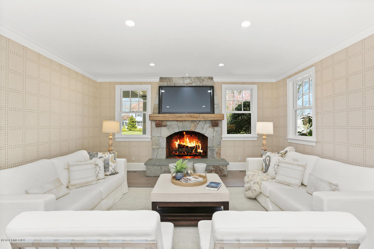 28 Welwyn Road Riverside, CT 06878 - Photo 9 of 32 a living room with furniture and a fireplace