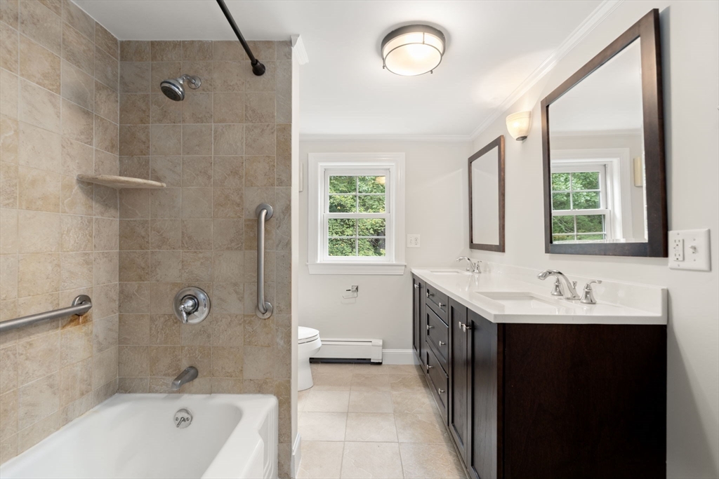 92 Abbot Street Andover, MA 01810 - Photo 25 of 35 a bath room with a sink a toilet and shower