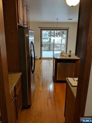 a view of a kitchen with electric appliances