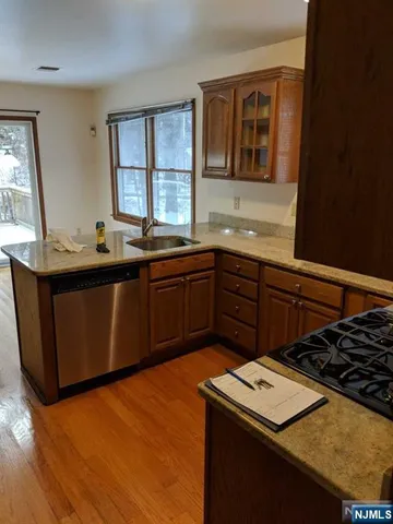 a kitchen with a sink stove and microwave