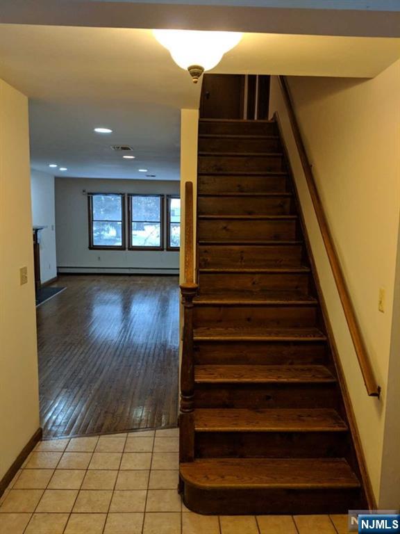 4 Lee Court Waldwick, NJ 07463 - Photo 8 of 15 a view of entryway and hall with wooden floor