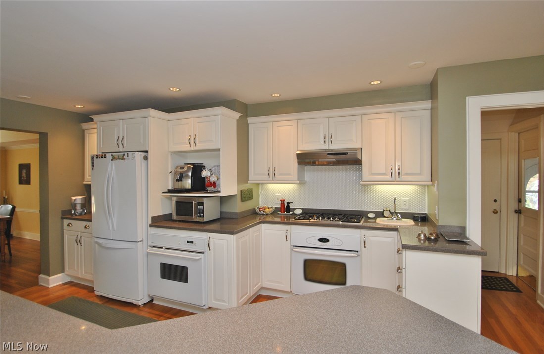2881 Bellaire Road Silver Lake, OH 44224 - Photo 9 of 29 Appliances include side by side refrigerator, two ovens, gas cooktop, microwave and a second sink for convenience.