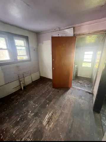 a view of a house with potted plants