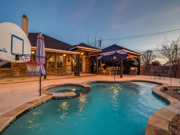 a view of pool with outdoor seating