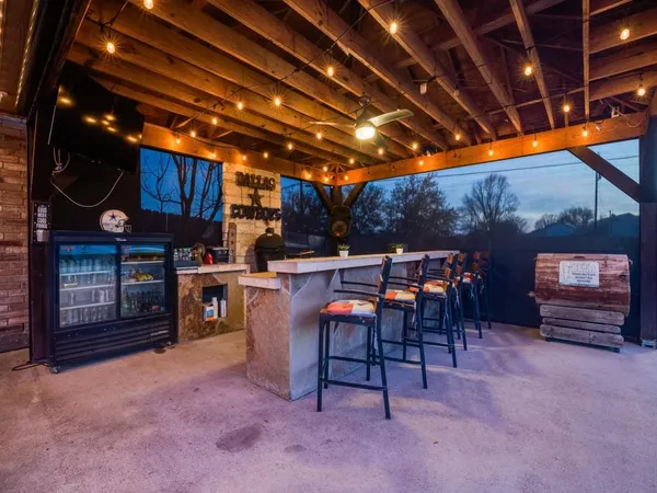 a view of a chairs and tables in patio