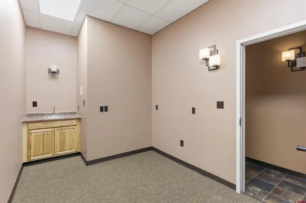a view of a storage & utility room with closet area