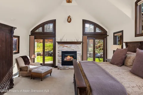 a bathroom with a bathtub sink and mirror