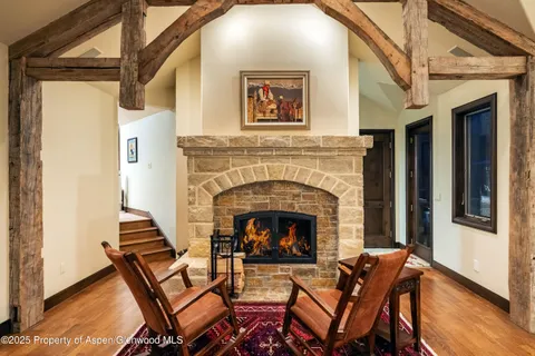 a view of a livingroom with furniture and a fireplace