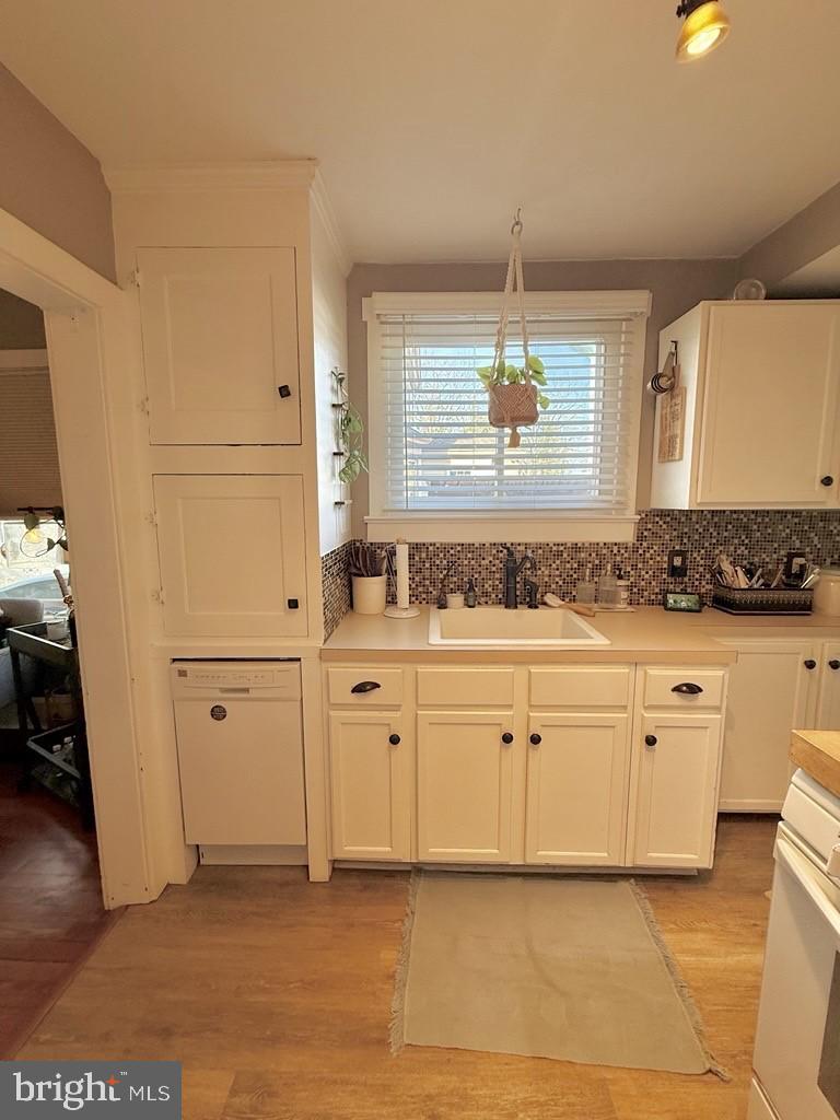 65 Arbutus Avenue Pitman, NJ 08071 - Photo 11 of 28 a bathroom with a sink and a mirror