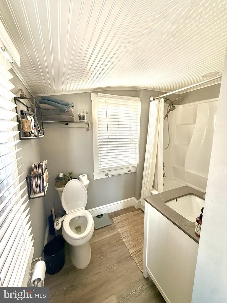 65 Arbutus Avenue Pitman, NJ 08071 - Photo 13 of 28 a bathroom with a sink mirror vanity and toilet