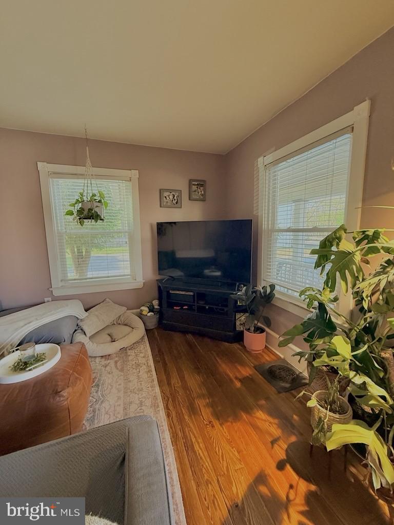 65 Arbutus Avenue Pitman, NJ 08071 - Photo 6 of 28 a living room with furniture a flat screen tv and a fireplace