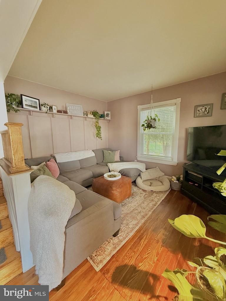 65 Arbutus Avenue Pitman, NJ 08071 - Photo 7 of 28 a living room with furniture and a flat screen tv