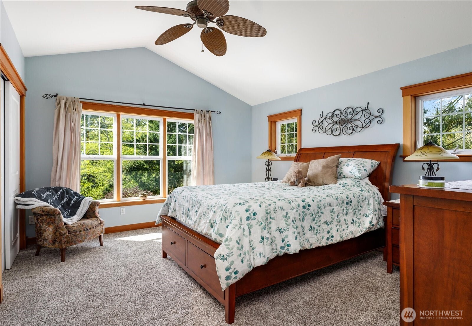 8210 Nob Road Clinton, WA 98236 - Photo 16 of 40 a bed sitting in a bedroom next to a window