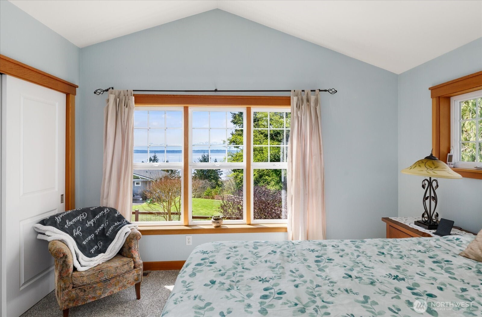 8210 Nob Road Clinton, WA 98236 - Photo 17 of 40 a bedroom with a bed and wooden floor