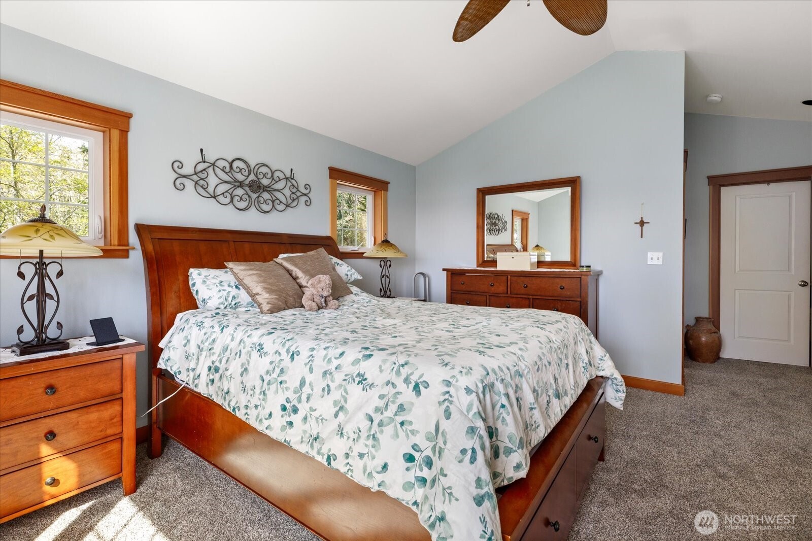 8210 Nob Road Clinton, WA 98236 - Photo 18 of 40 a bedroom with a bed and painting on the wall