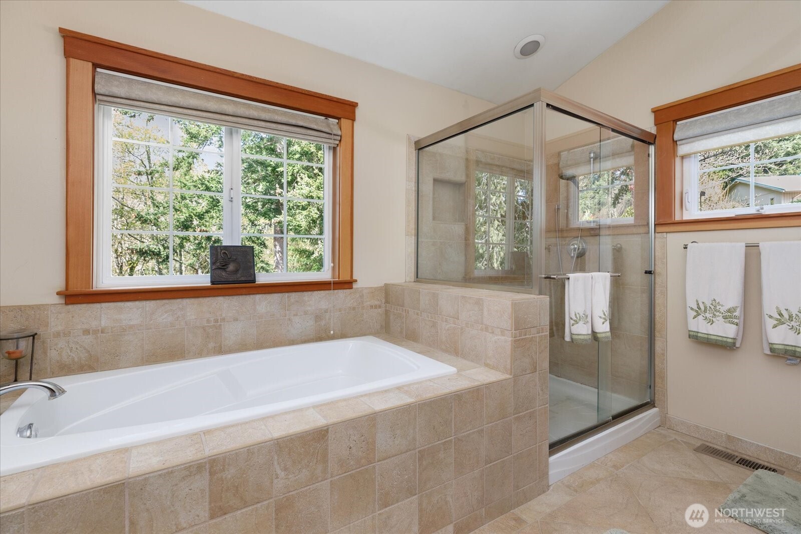 8210 Nob Road Clinton, WA 98236 - Photo 19 of 40 a spacious bathroom with a bathtub and a shower