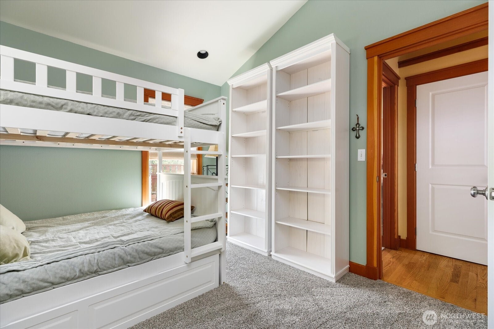 8210 Nob Road Clinton, WA 98236 - Photo 22 of 40 a bedroom with a bed and a walk in closet