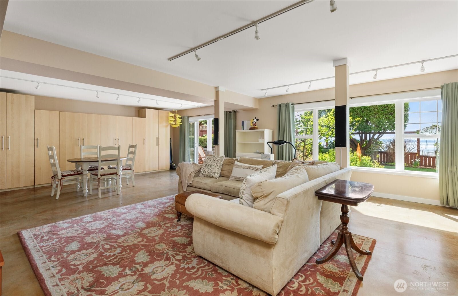 8210 Nob Road Clinton, WA 98236 - Photo 26 of 40 a living room with furniture and a large window