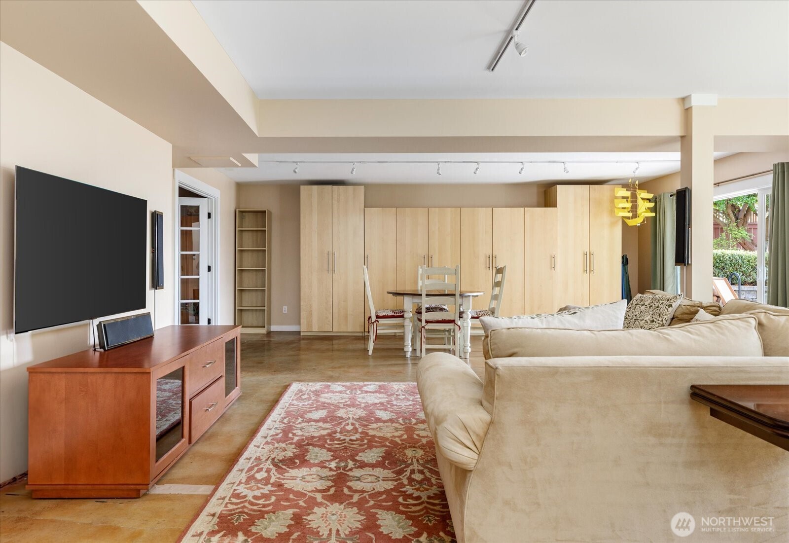 8210 Nob Road Clinton, WA 98236 - Photo 27 of 40 a living room with furniture and a flat screen tv