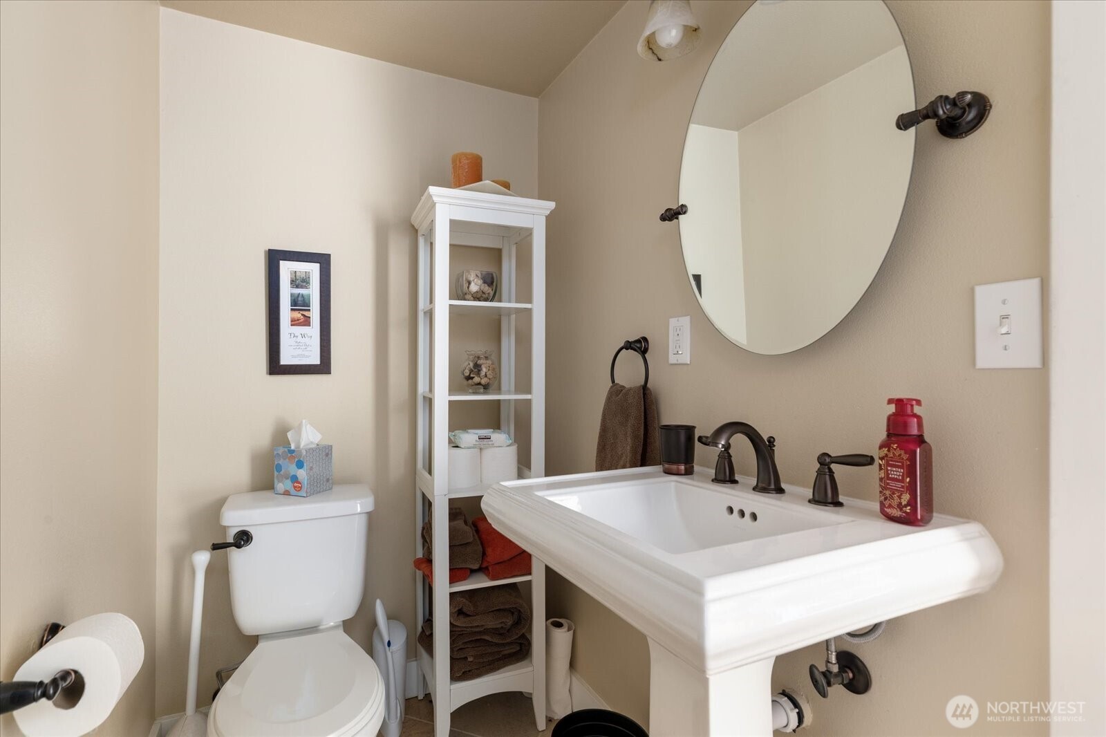 8210 Nob Road Clinton, WA 98236 - Photo 31 of 40 a bathroom with a sink a toilet and a mirror