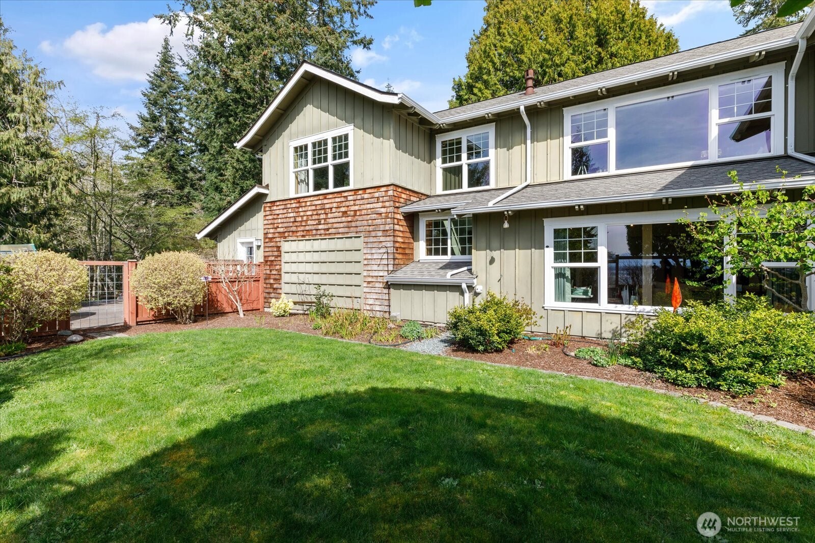 8210 Nob Road Clinton, WA 98236 - Photo 33 of 40 a front view of a house with a yard and porch