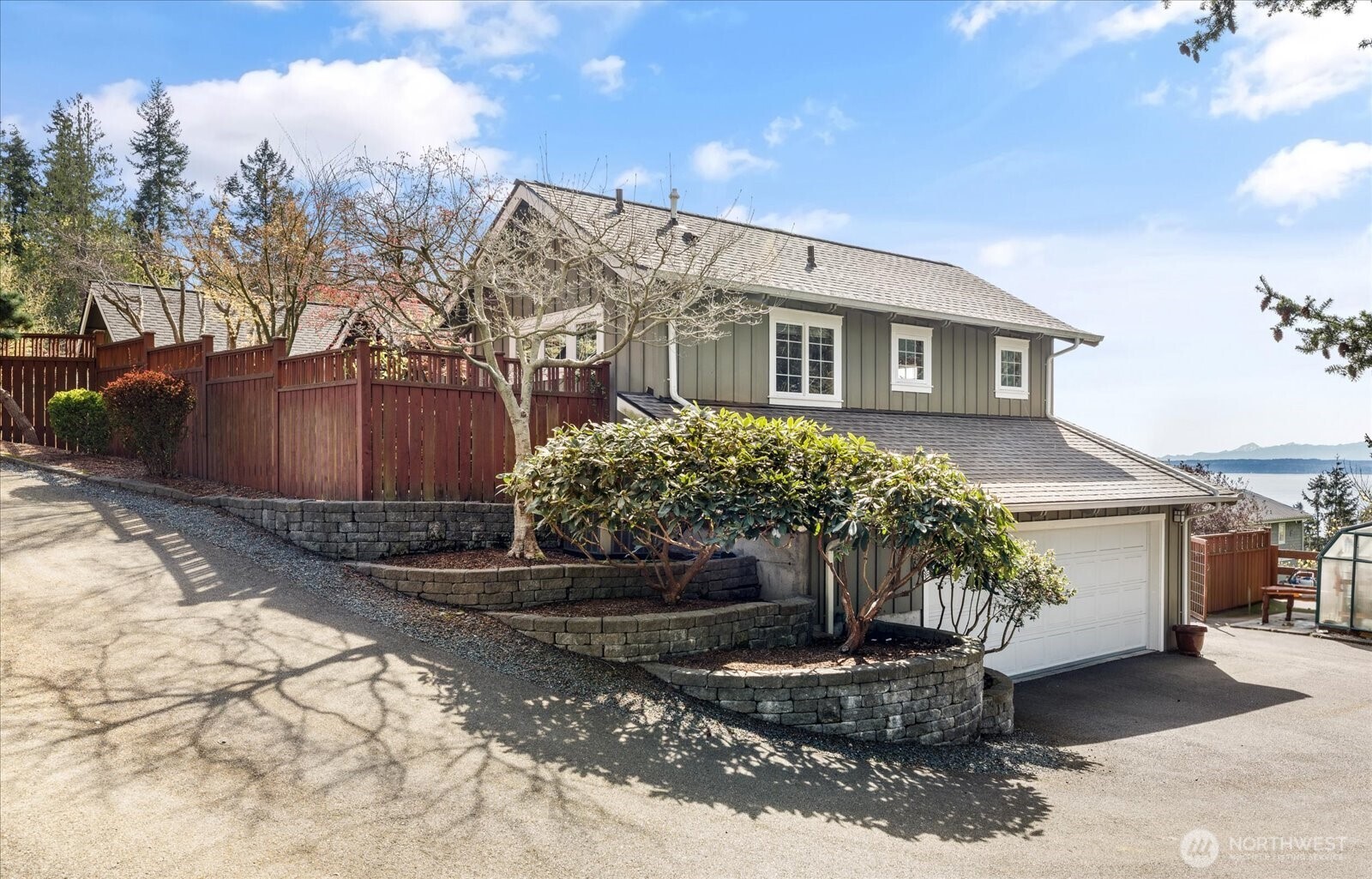 8210 Nob Road Clinton, WA 98236 - Photo 37 of 40 a front view of a house with garden