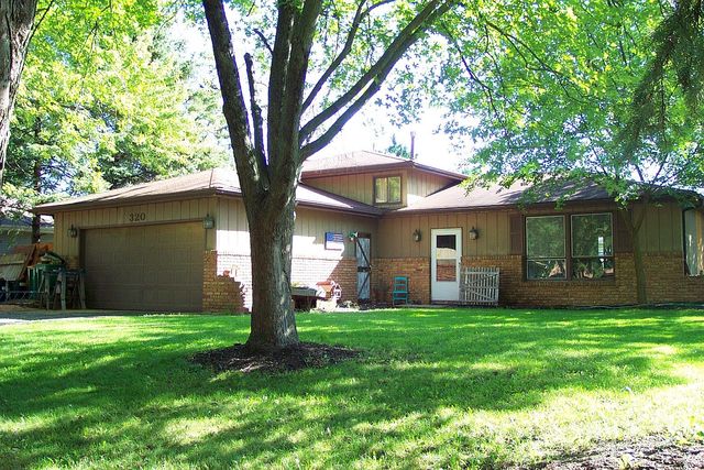 320 Kay Street Manhattan, IL 60442 - Photo 1 of 27 a view of a house with a yard and tree