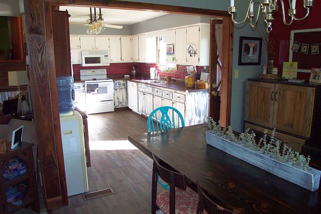320 Kay Street Manhattan, IL 60442 - Photo 12 of 27 a kitchen with stainless steel appliances kitchen island granite countertop a stove refrigerator and cabinets