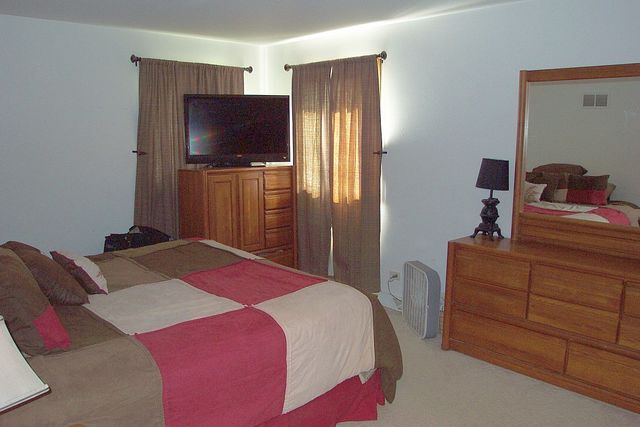 320 Kay Street Manhattan, IL 60442 - Photo 14 of 27 a bedroom with a bed and a flat screen tv